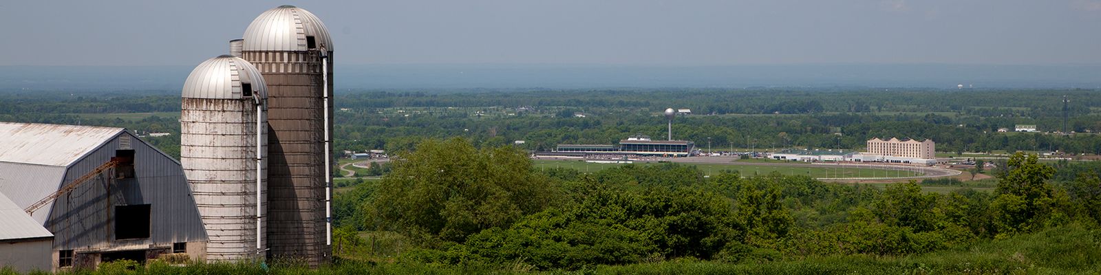 A view of a local farm with Vernon Downs in the background